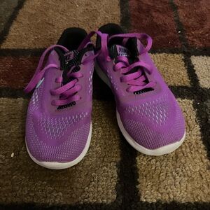 pair of nike slightly worn shoes. these shoes are size kids 13.